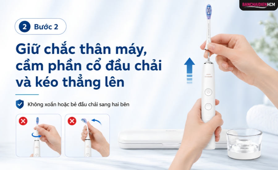 Giữ chắc thân máy, cầm phần cổ đầu chải và kéo thẳng lên. Không xoắn hoặc bẻ đầu chải sang hai bên